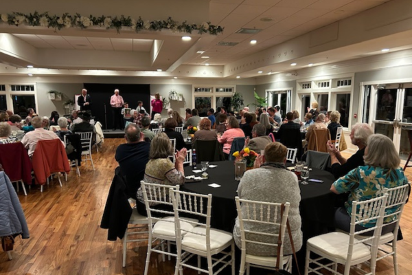 Guests gathered for a community fundraiser at The Oaks’ Grandview venue, with a full seated audience, stage presentations, and the venue’s bright, open event space showcased.