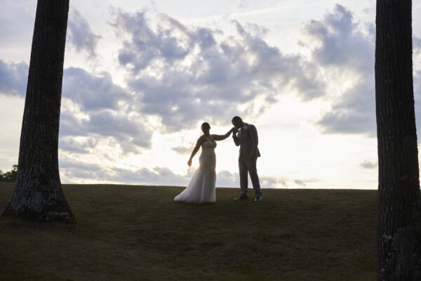 Couple posing in the outdoor wooded area of The Grandview Venue at The Oaks