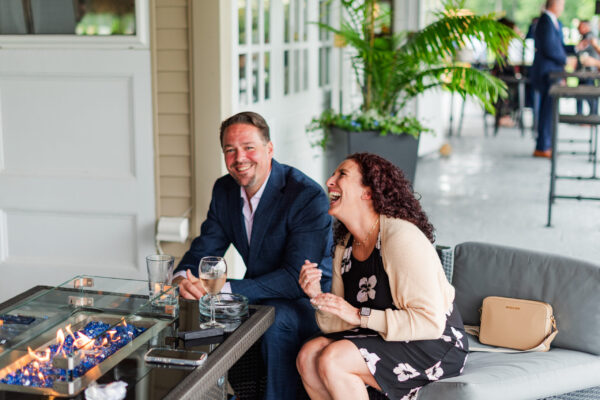 Couple laughing on the patio at The Grandview Venue