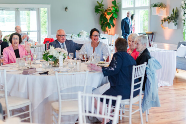 Wedding guests enjoying each others' company at a wedding reception at The Grandview