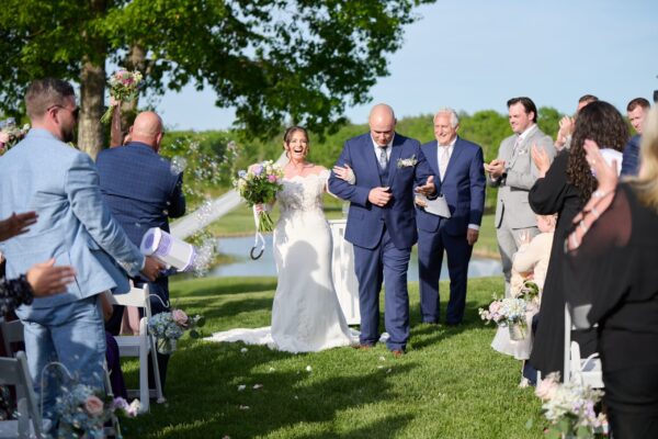 Couple walking down the aisle after their wedding ceremony at The Grandview